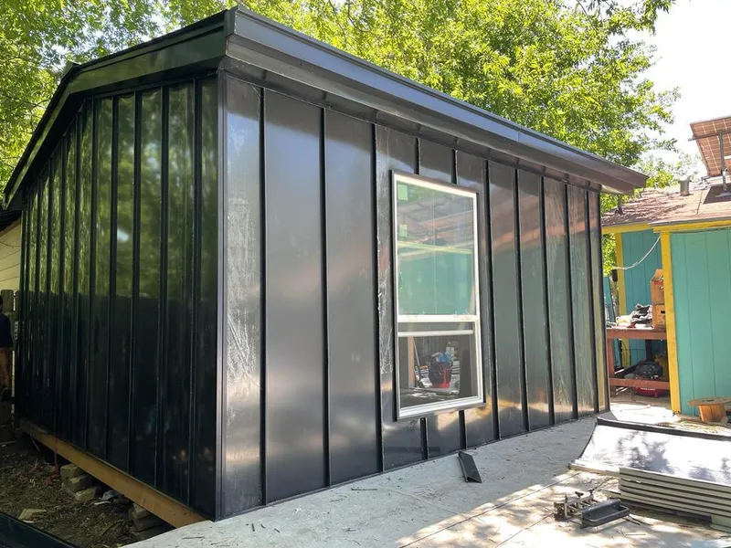 Black standing seam metal wall panels for Metal Roof Installation in Swanton